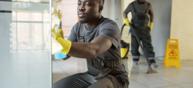 full-shot-men-cleaning-office